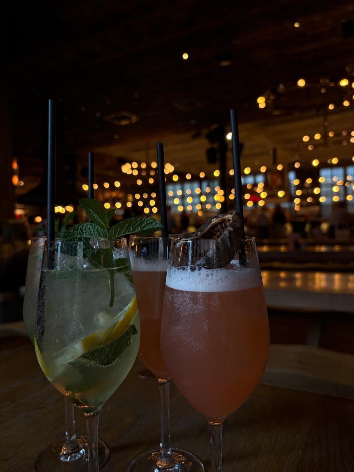 Drinks on a table in a softly lit venue